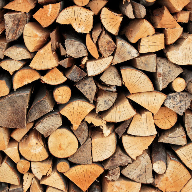 Bags filled with cut wood pieces labeled "Ready to Burn."