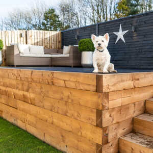 garden wall made from pressure treated timber sleepers