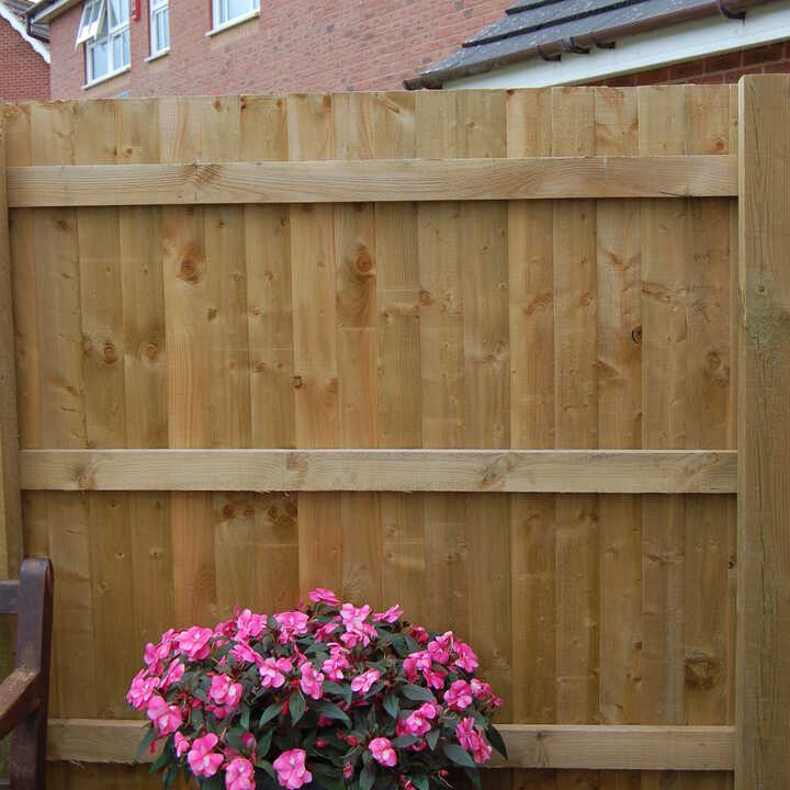 Featheredge timber fence with concrete gravel board