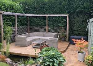 Timber decking area in a garden Timber decking area in a garden
