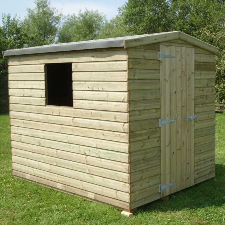 Standard Apex shed with a door and window, surrounded by grass and trees.