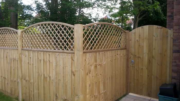 Round top timber fencing and garden gate