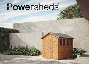 Powershed on a paved area with greenery in the background.
