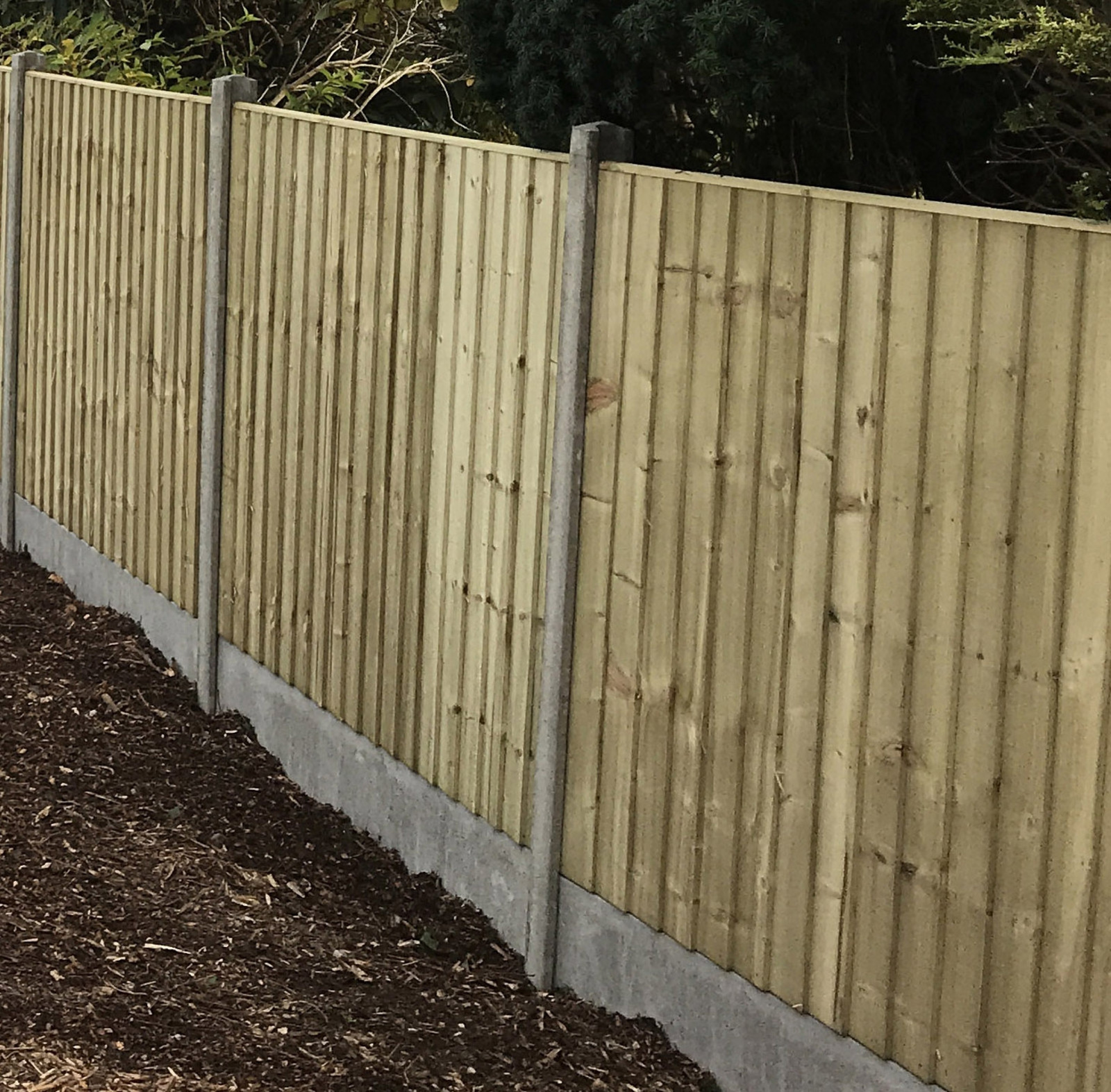 pressure treated stockade fence